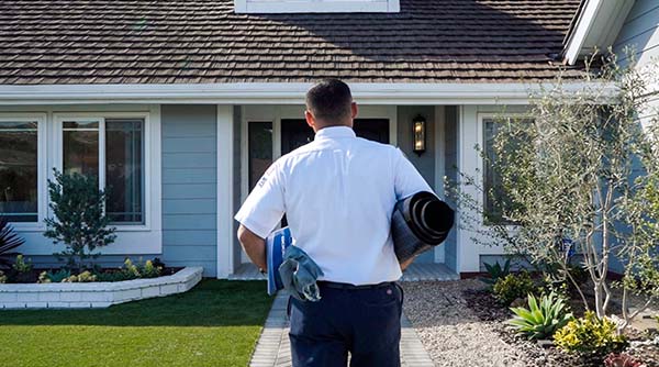 In This Image We See A Service Champions Technician Walking Up To A Home To Deliver The Best Baldwin Park Ac Repair Service.