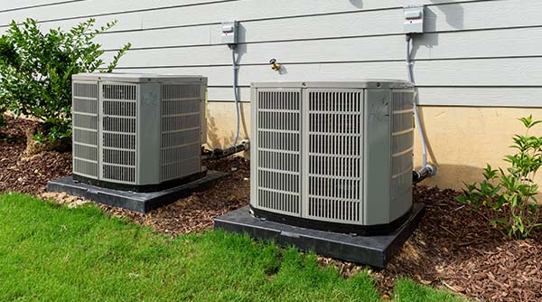 Image: Two New Condensers Side By Side. Call Service Champions For Pico Rivera Air Conditioner Service.