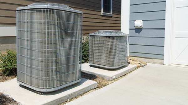 Image: Two Condensers Side By Side, One Is Bigger Than The Other. Also, Don'T Forget To Call Service Champions For The Best South Pasadena Ac Repair Service.