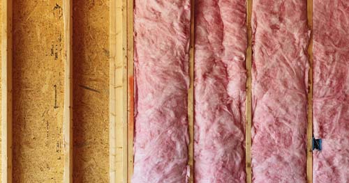 Image: Insulation Being Installed In An Attic.