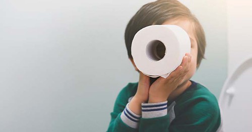 Image: A Child Playing With A Toilet Paper Roll.