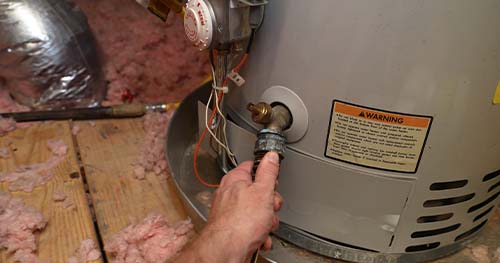 Image: A person looking to extend the life of a water heater by shaping a water heater flow